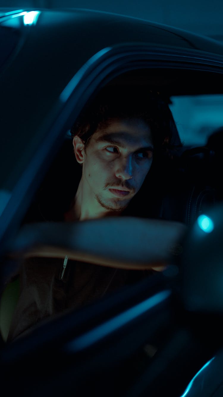 Man In Car At Night