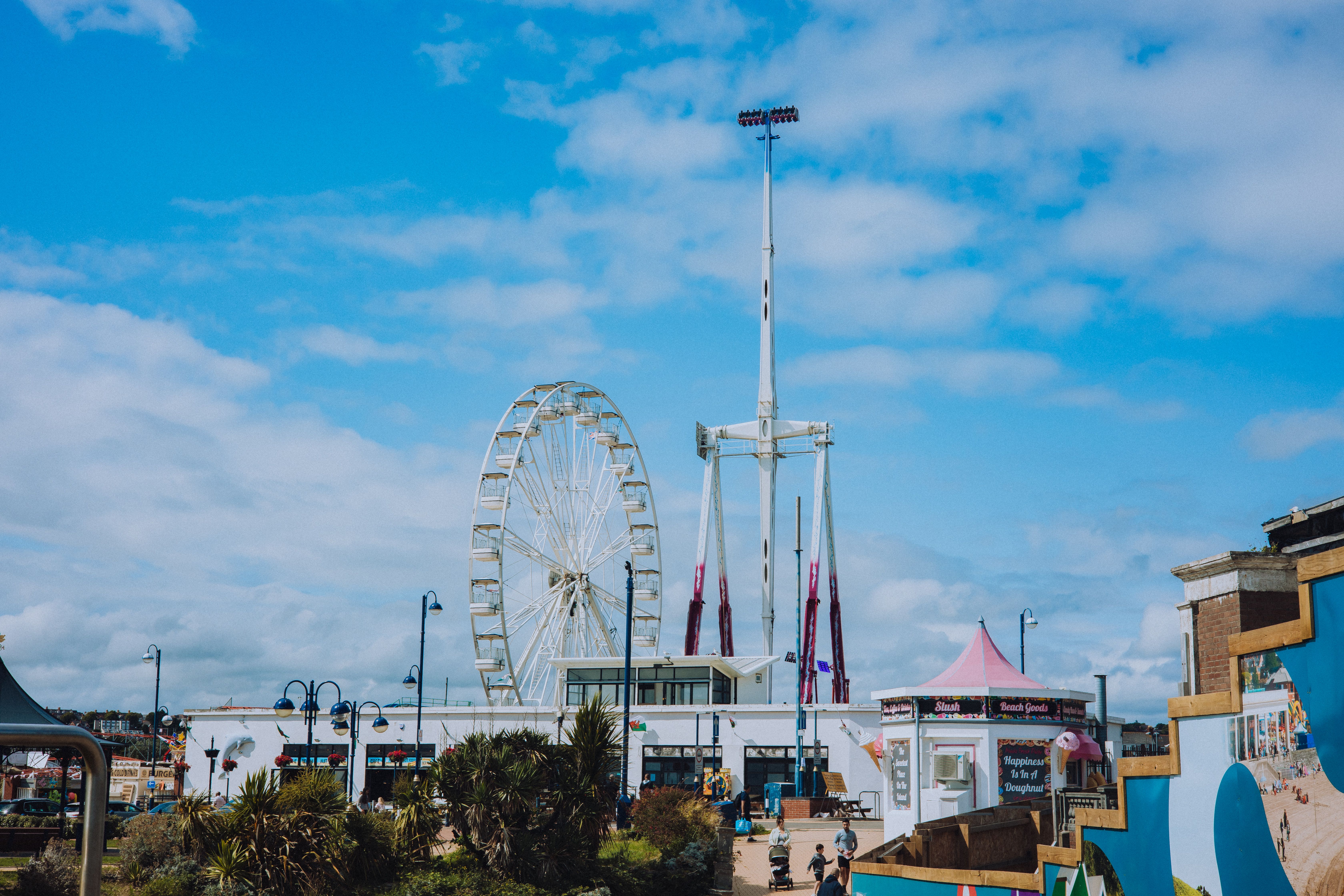 Ferris Wheel and a Pendulum Ride Standing against the Sky · Free Stock ...
