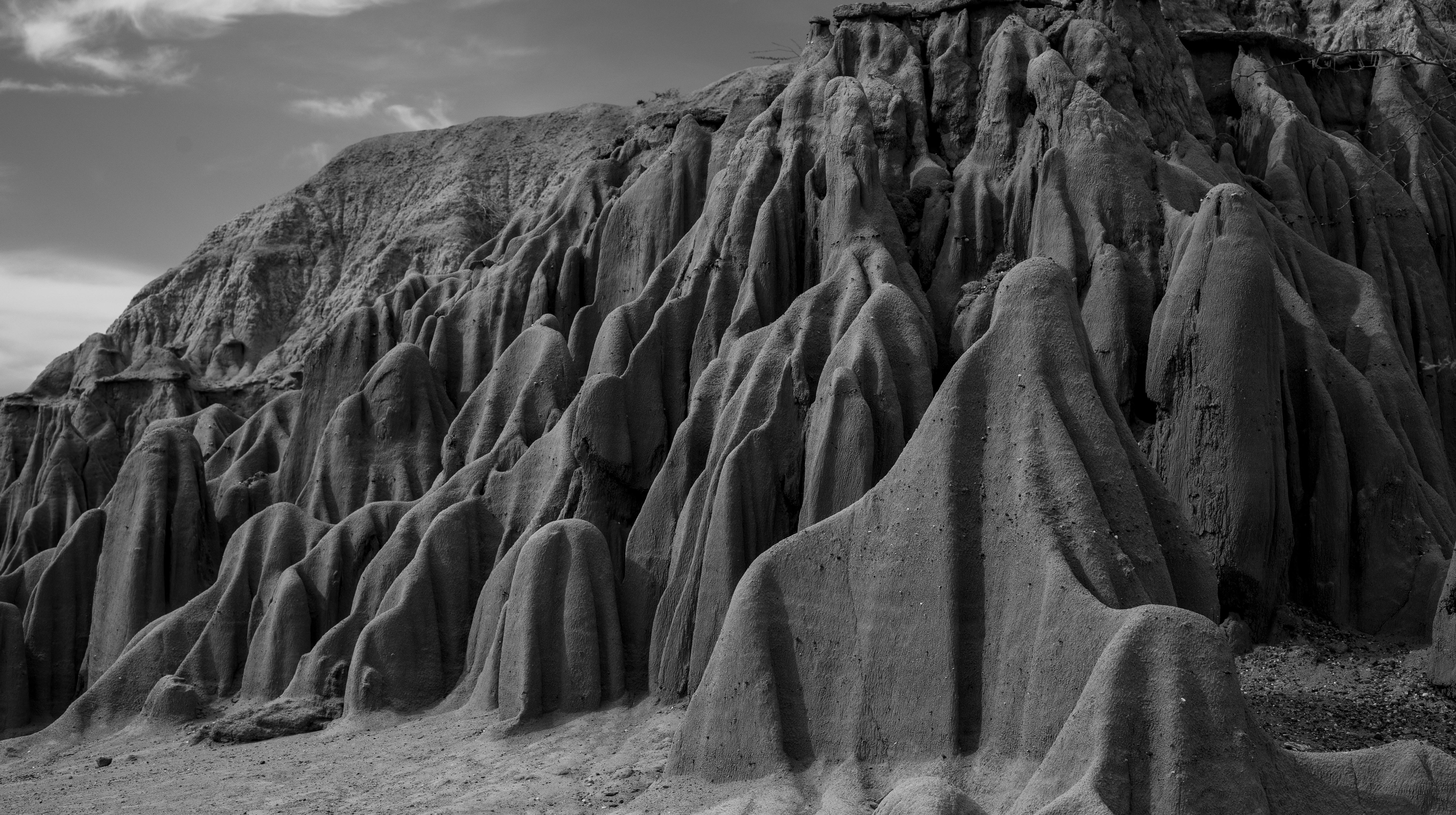 Monochrome view of eroded rock formations in Tatacoa Desert, Colombia.