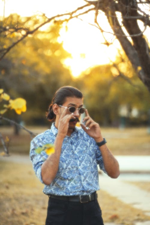 Elegant Man Standing in a Park