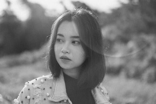 Young Brunette in Denim Jacket with Embellishments