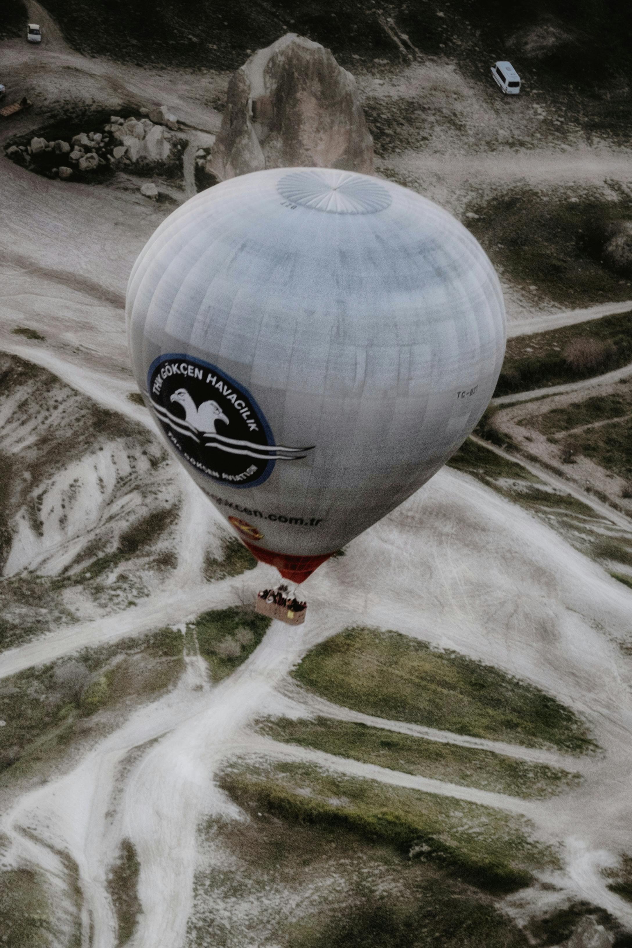Hot air balloon soaring over the unique landscapes of Cappadocia, Turkey.