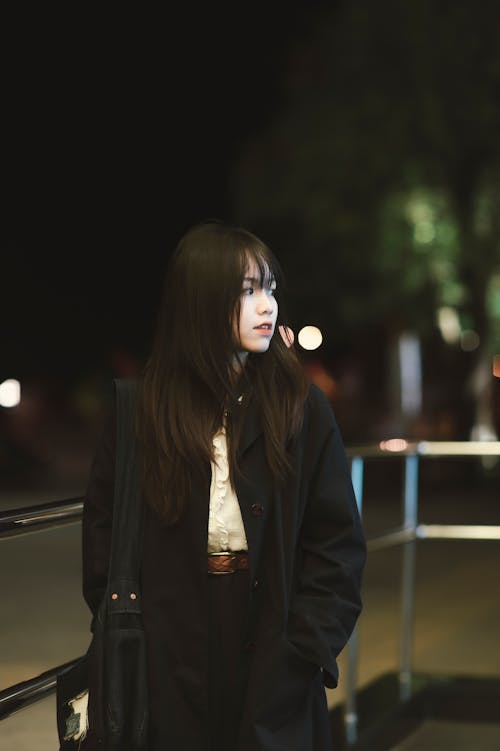 Portrait of a Young Woman Wearing a Black Coat