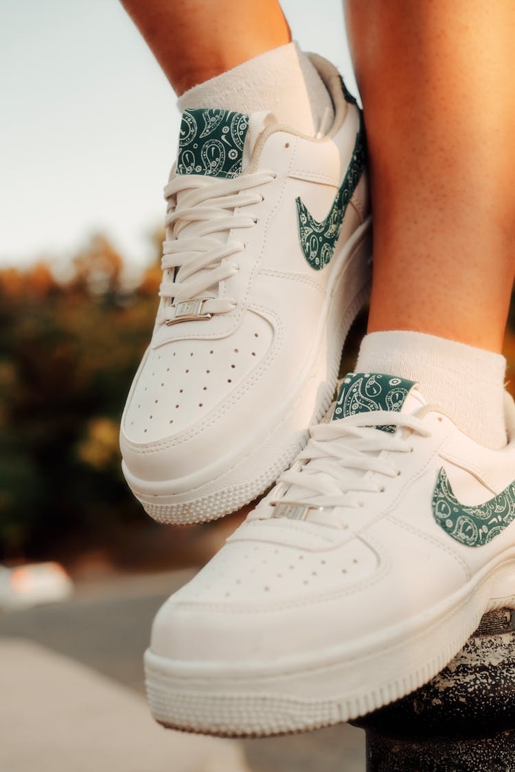 A Person Wearing Nike Air Force 1 Sneakers