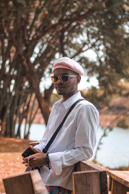 Young Fashionable Man Standing in a Park