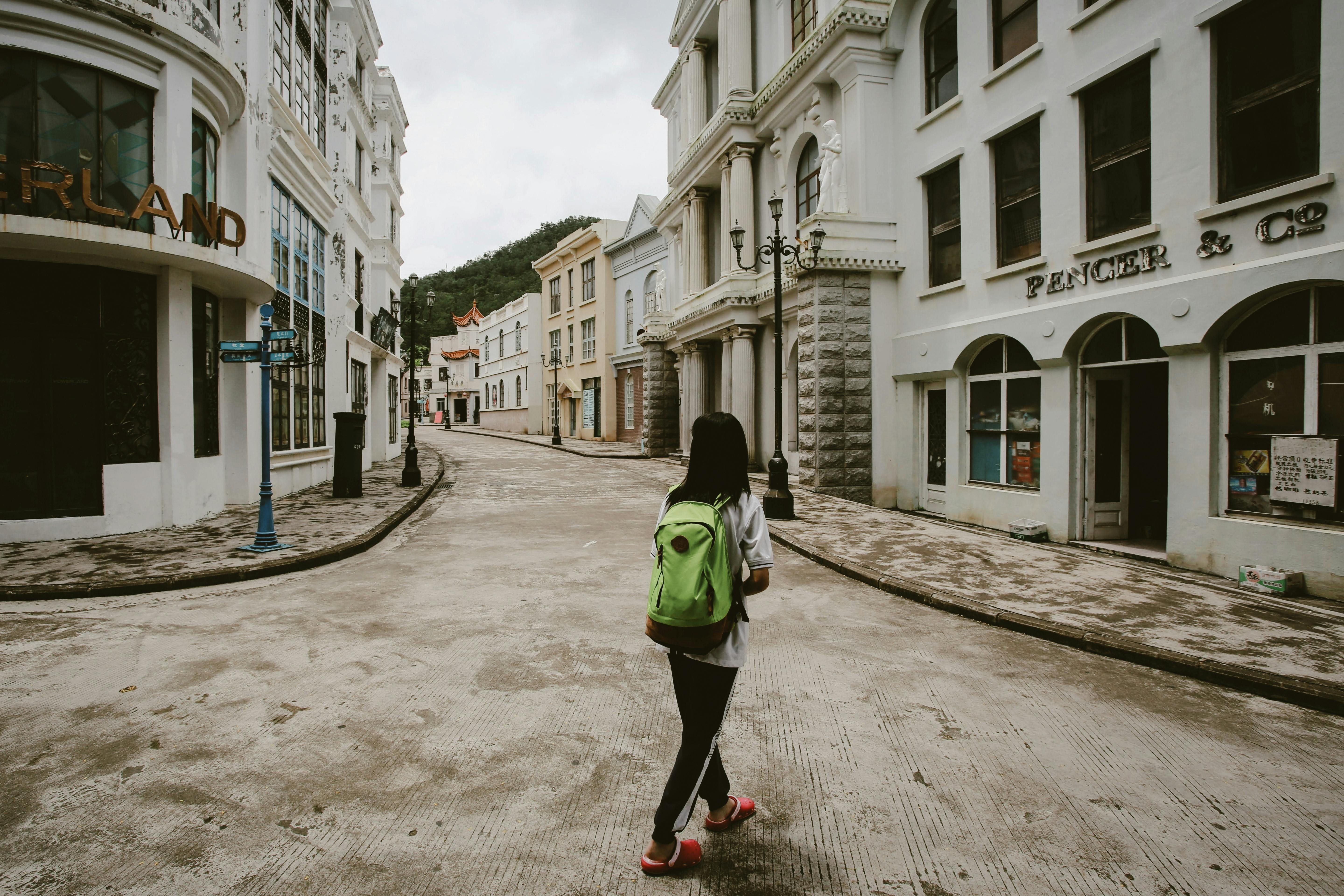 solo traveler walking through the charming streets of Georgetown, D.C. - solo trip ideas