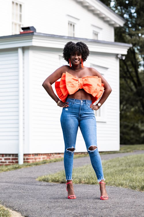 Woman Wearing Jeans and a Bow Top