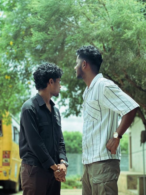 Free Two Indian men standing outdoors in vibrant summer fashion, highlighting casual style. Stock Photo