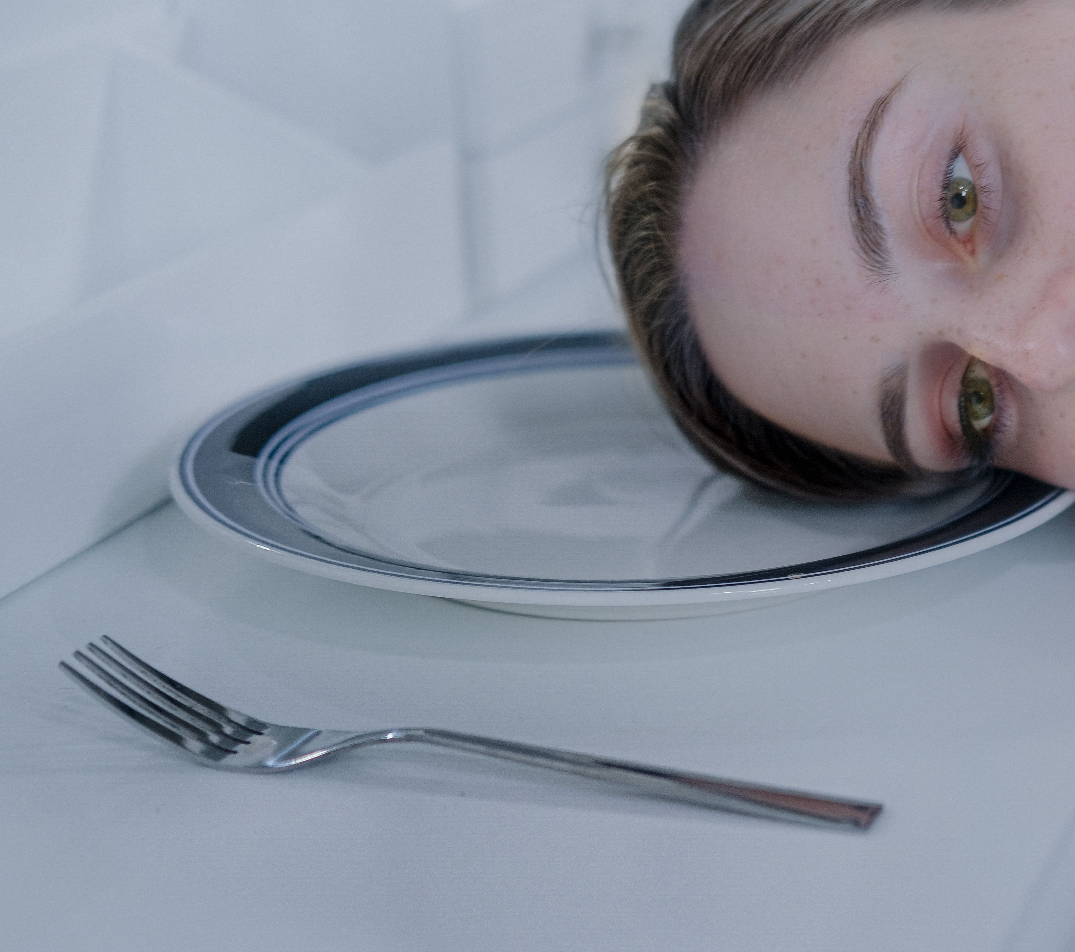 Woman Head Lying On A Plate Free Stock Photo