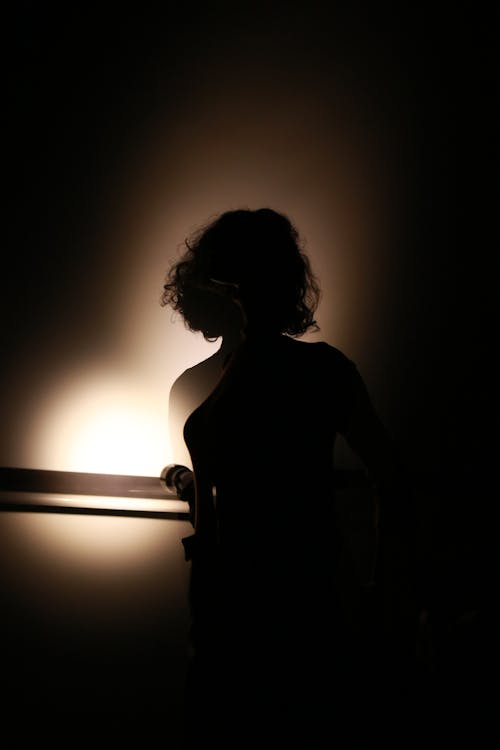 Silhouette of Woman in the Dark 