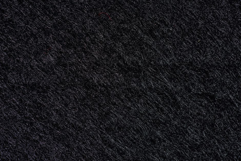 A detailed monochrome texture with dark, gritty pattern for background use.