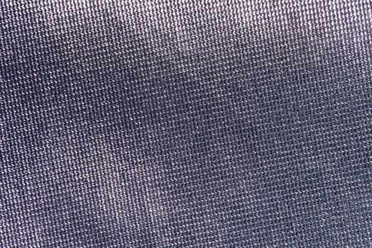 Detailed close-up texture of gray fabric, ideal for backgrounds and design projects.