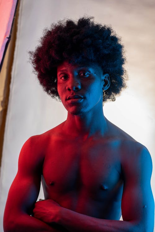 Portrait of a Shirtless Man with Curly Hair