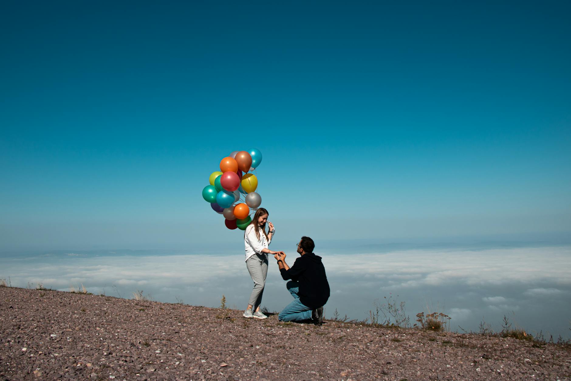 Man Engaging with Woman with Balloons