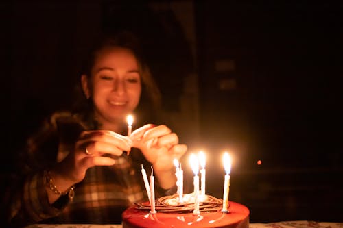Happy Woman Holding Candle for Birthday Cake