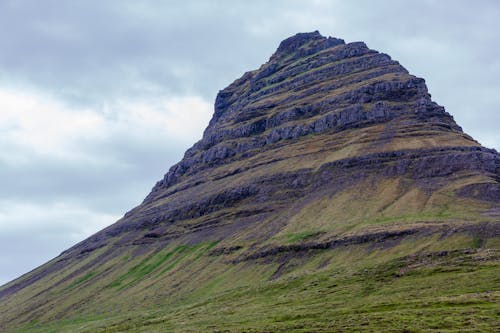 A mountain with a large rock on top