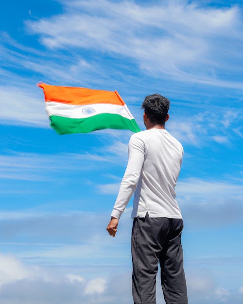 Back View of Man Standing with Indian Flag