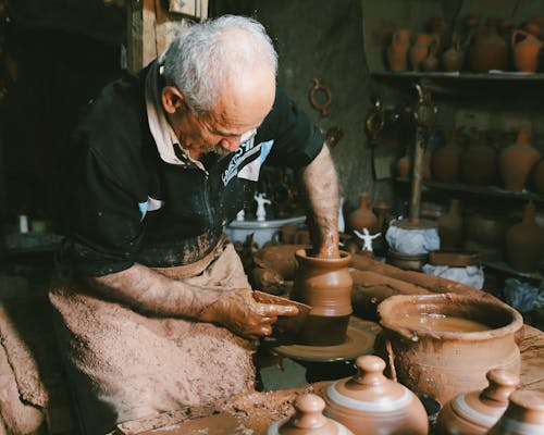 Old Man Making Clay Pottery