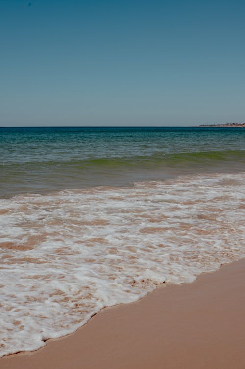 Foamy Waves Washing Up the Beach 