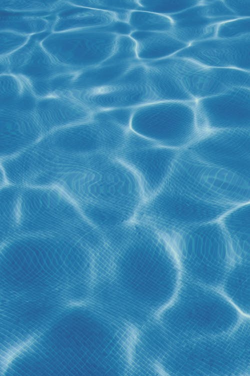 Close-up of Clear Blue Water in a Swimming Pool 