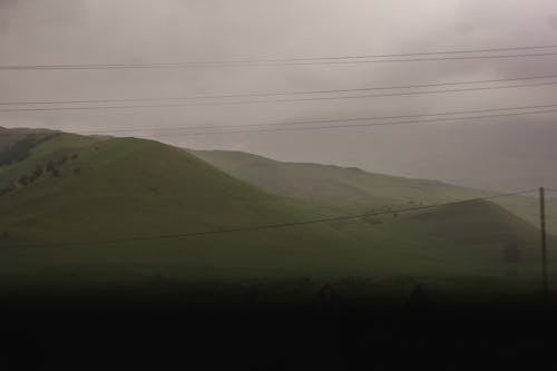 Green Hill on Foggy Day