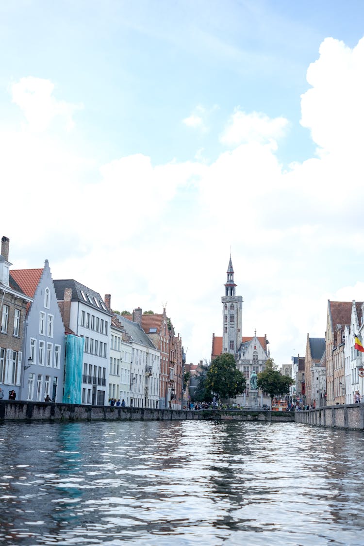 Waterfront View Of Jan Van Eyckplein Square In Bruges, Belgium