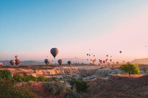 Hot Air Balloons Flying above Canyon