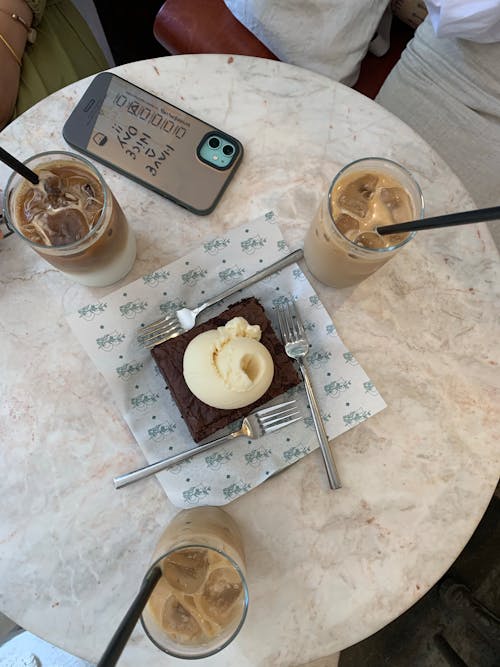 Three Glasses of Iced Coffee and Cake on the Table