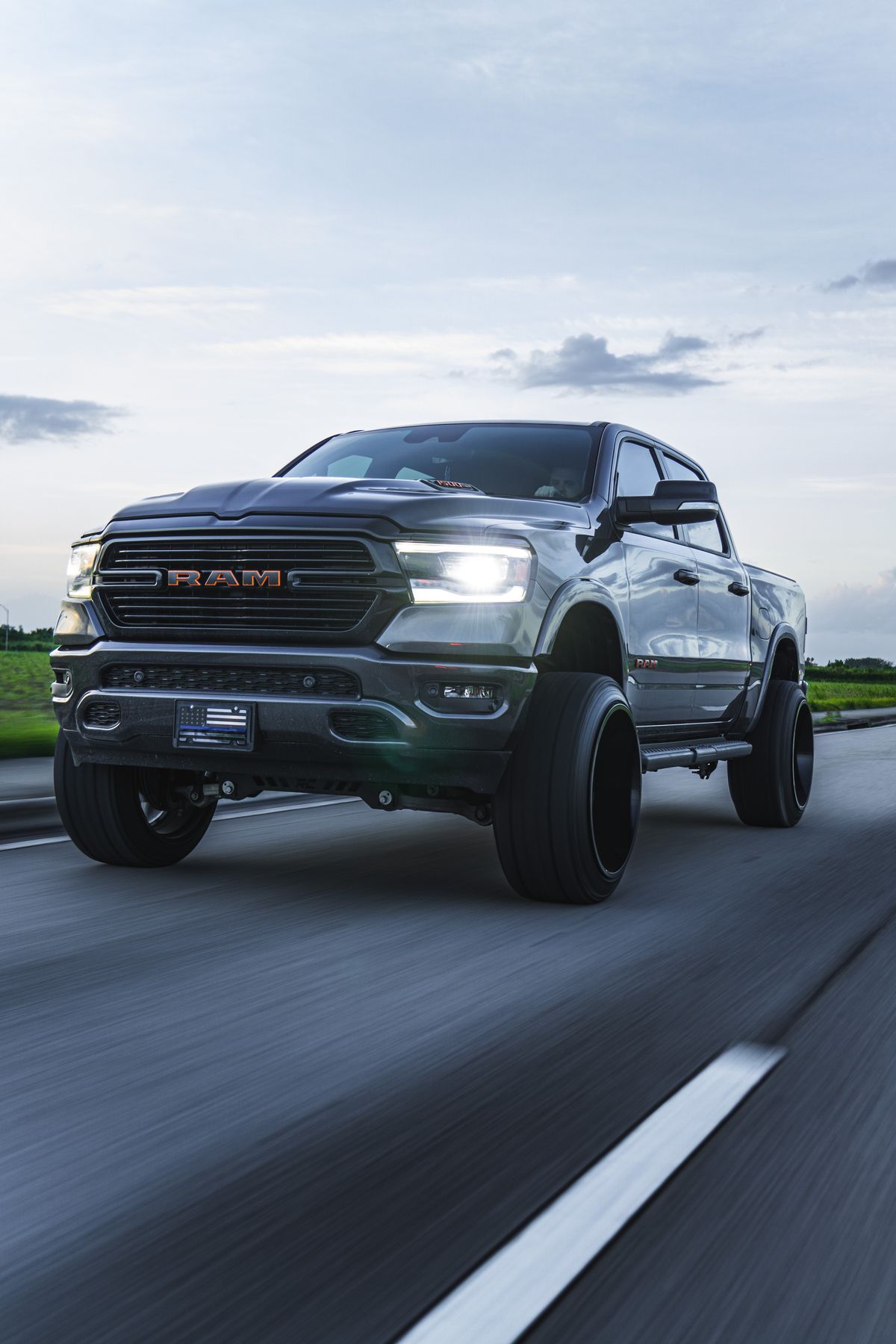 Pickup truck driving on an open road at speed