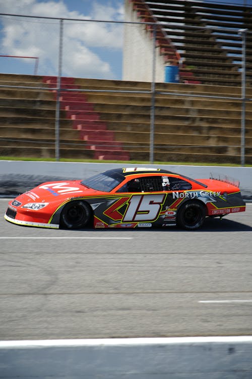 A Race Car Driving on a Race Track 