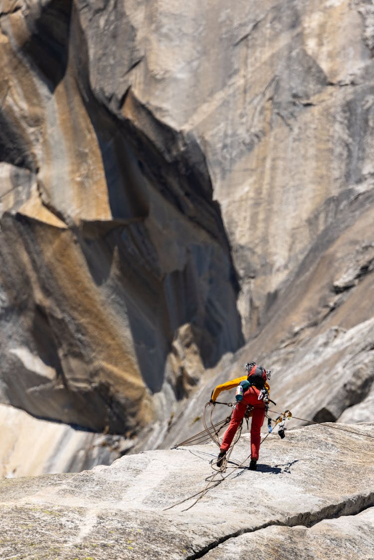 Mountaineer Climbing A Rock