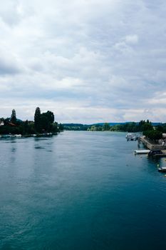 A serene view of Lake Constance featuring clear blue water and lush surroundings.