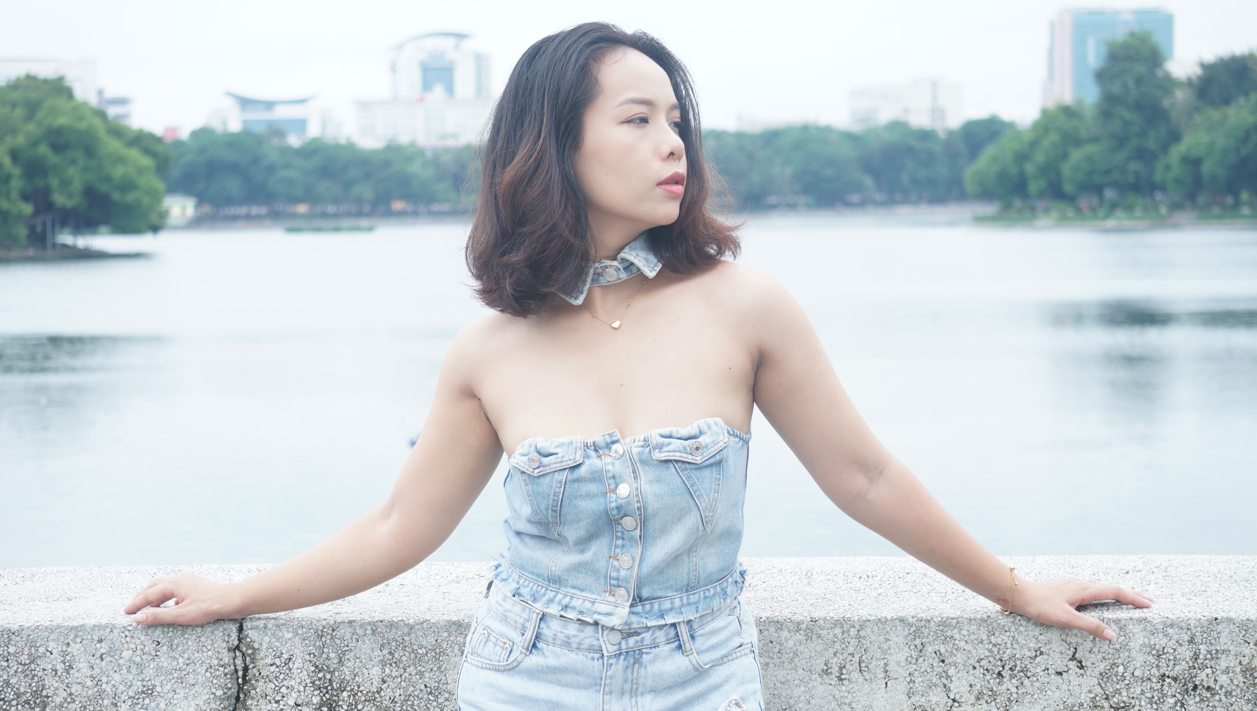 Young Woman Standing on a Bridge · Free Stock Photo