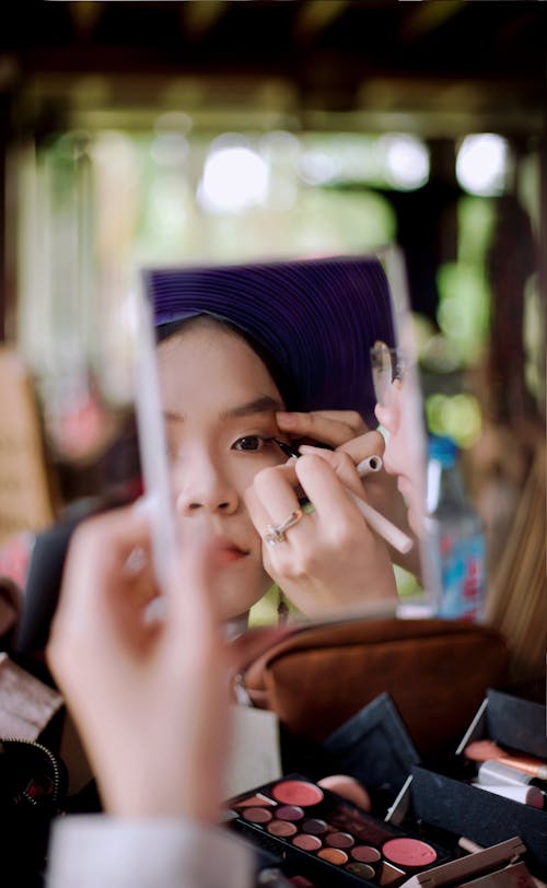 Asian Woman Doing Makeup
