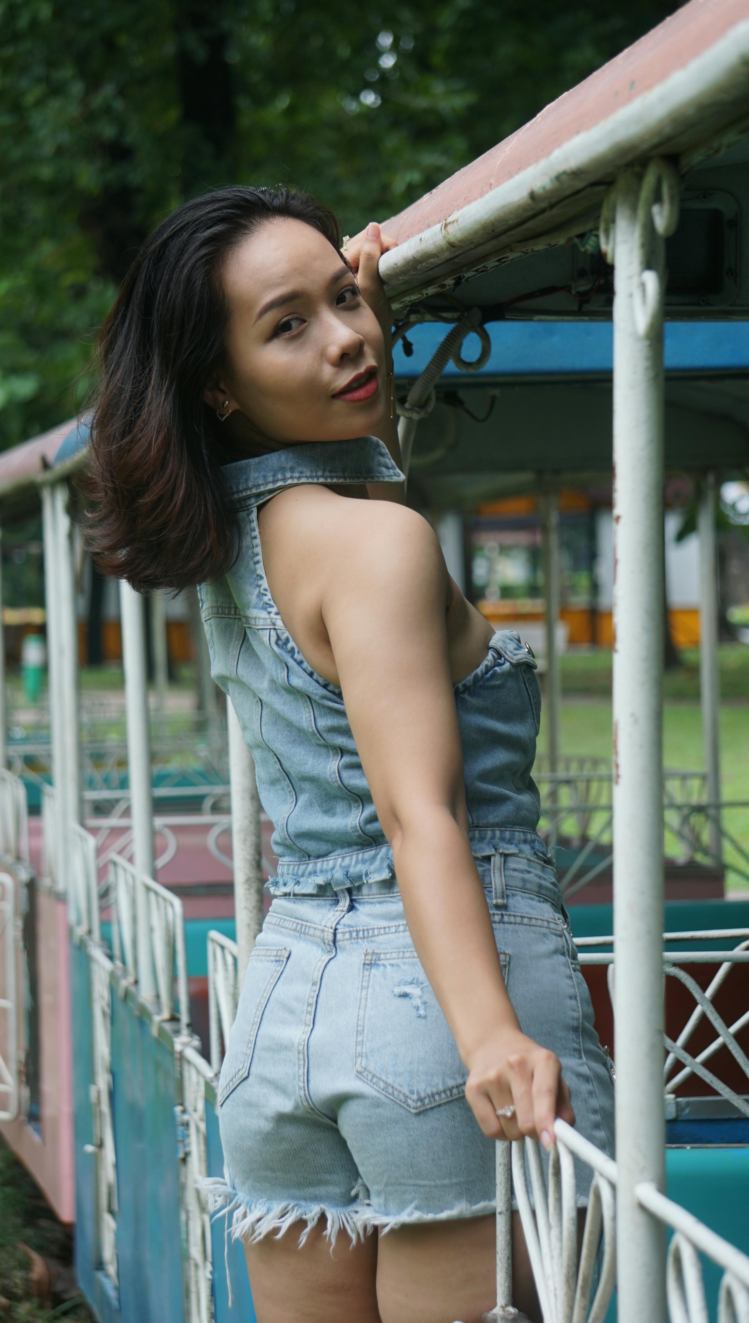 Woman with Black Hair Standing and Posing