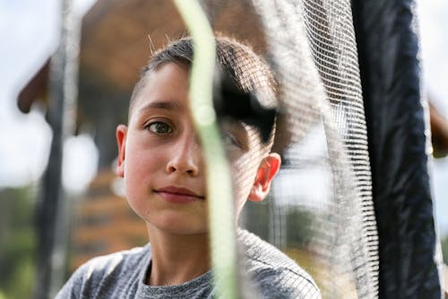 Boy Face near Net