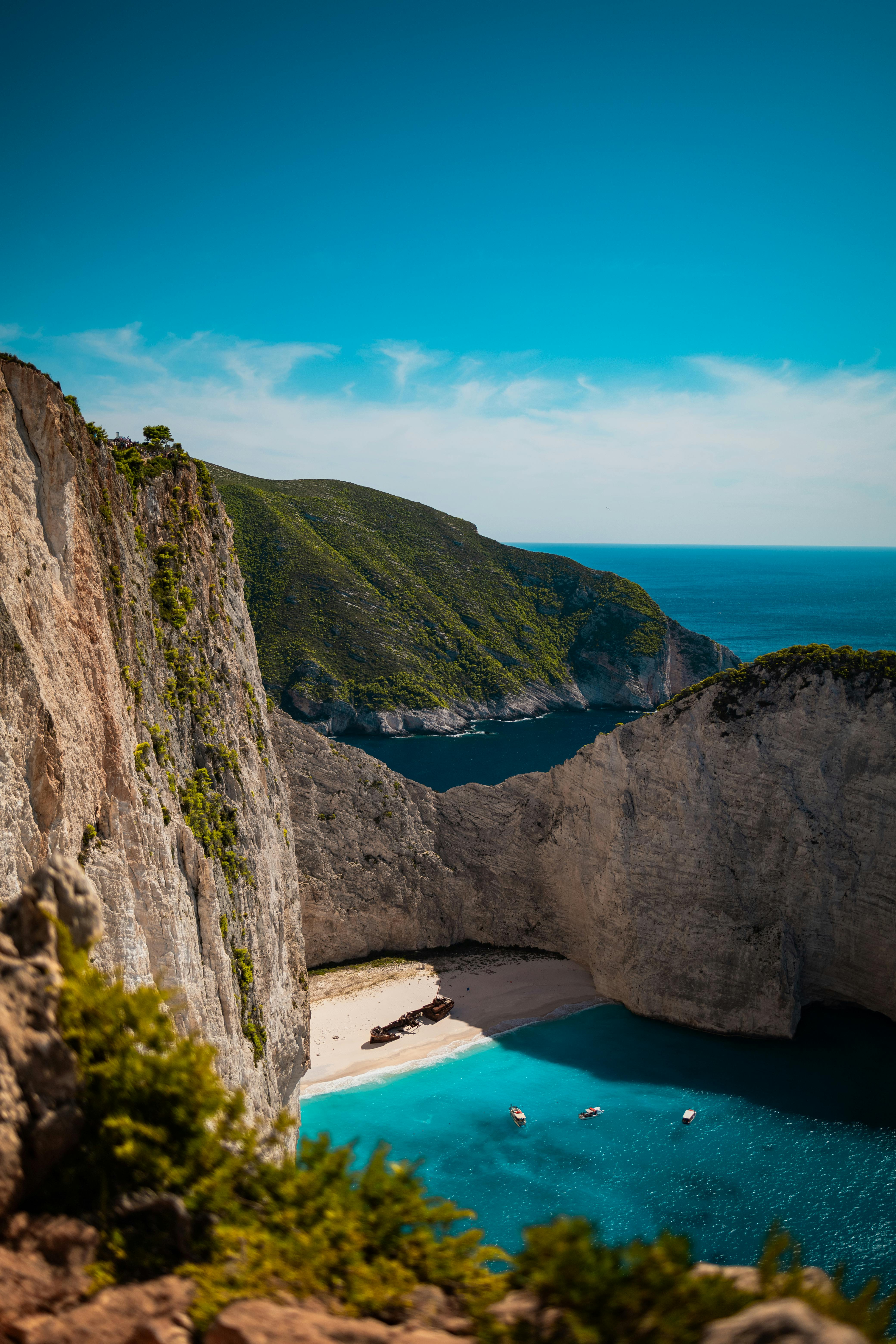 Discover the breathtaking cliffs and clear waters at Navagio Beach on Zakynthos Island, Greece.