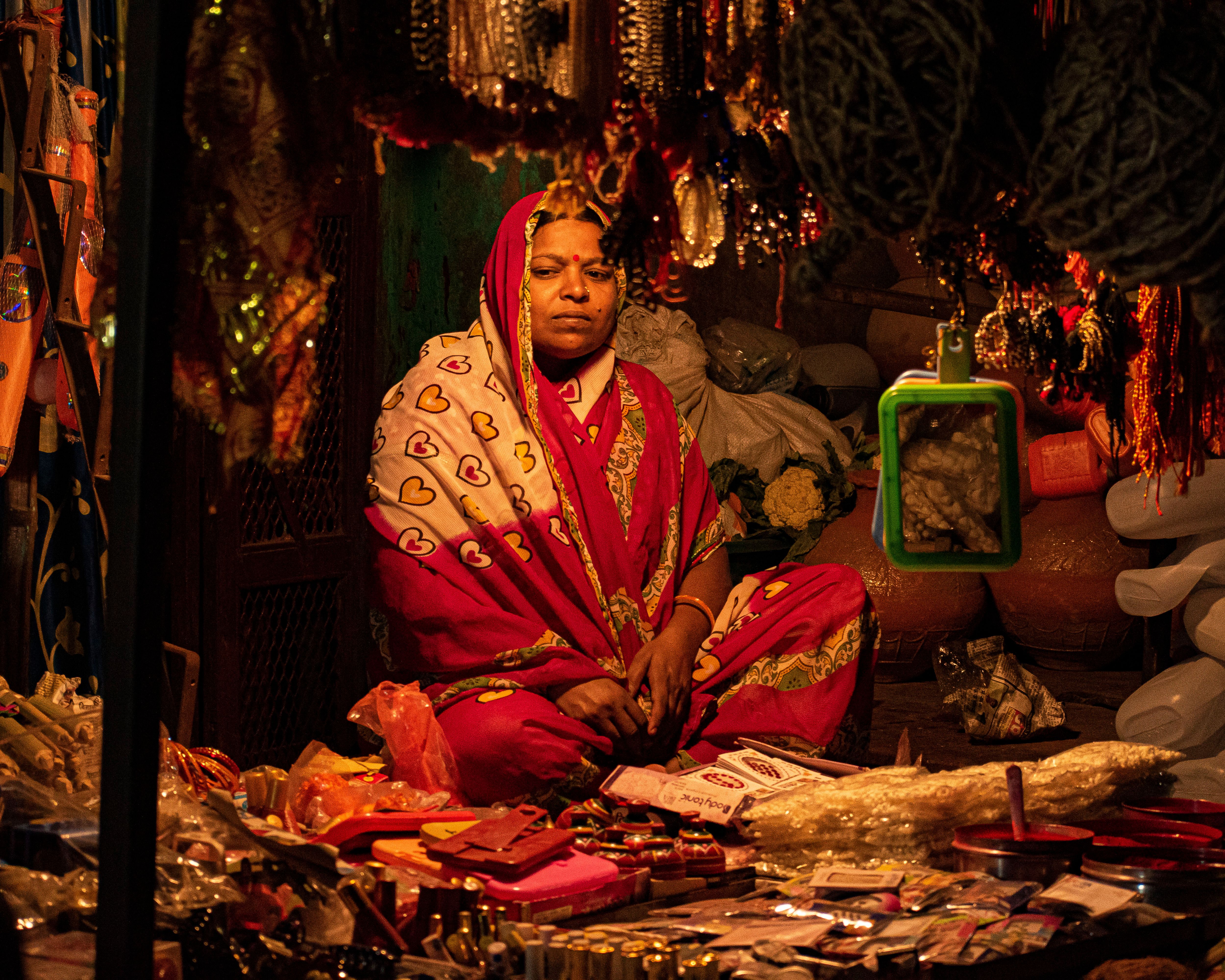 A market stall in Sadar Bazaar with textiles and brassware
