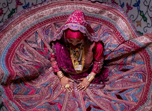 Free A stunning display of traditional attire featuring vibrant patterns and detailed embroidery, captured from above. Stock Photo