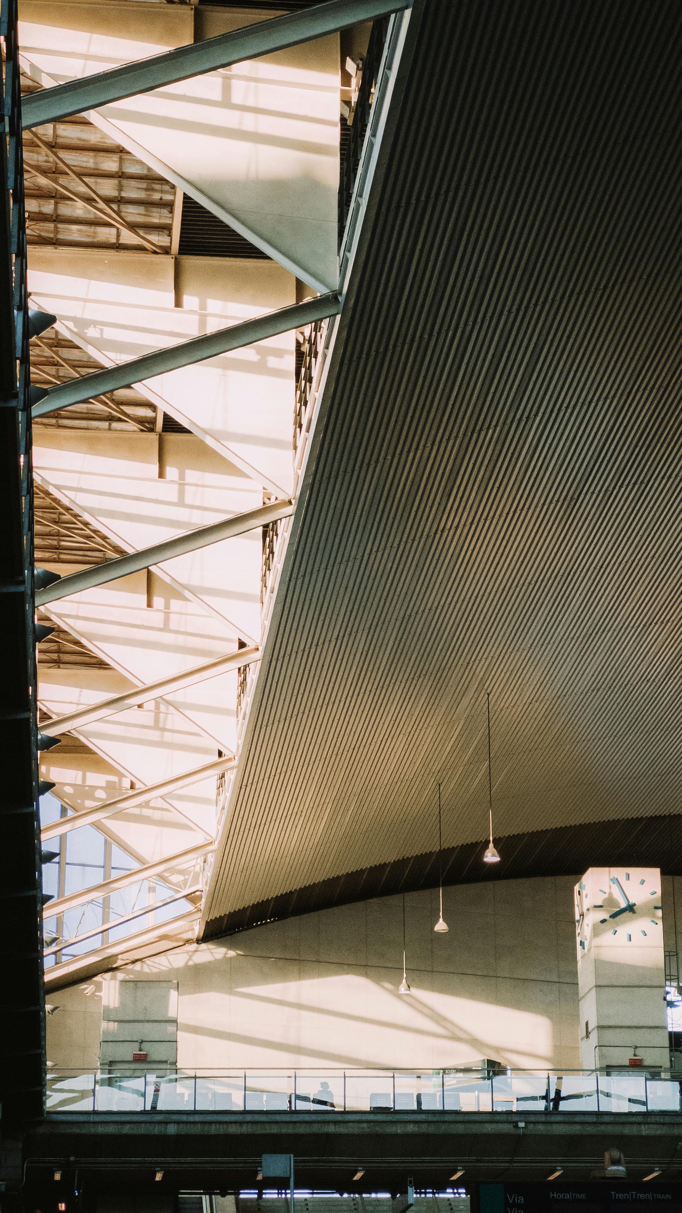 A contemporary architectural interior showcasing steel beams and natural lighting.