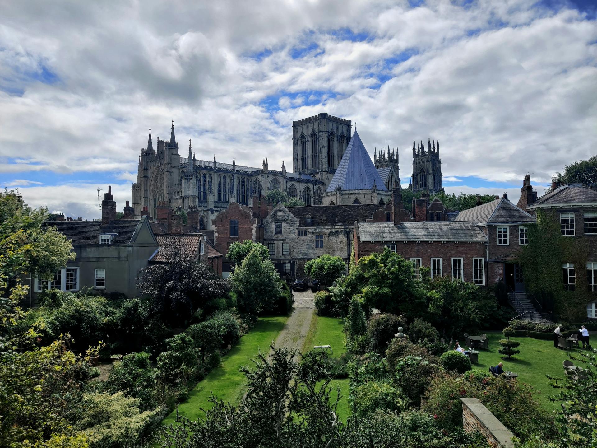 A breathtaking view of York Minster's gothic architecture from a nearby garden.