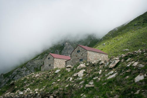 Cloud over Houses in Mountains