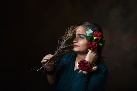 a girls looking Gorgeous and cute and red rose and looking cute and pretty