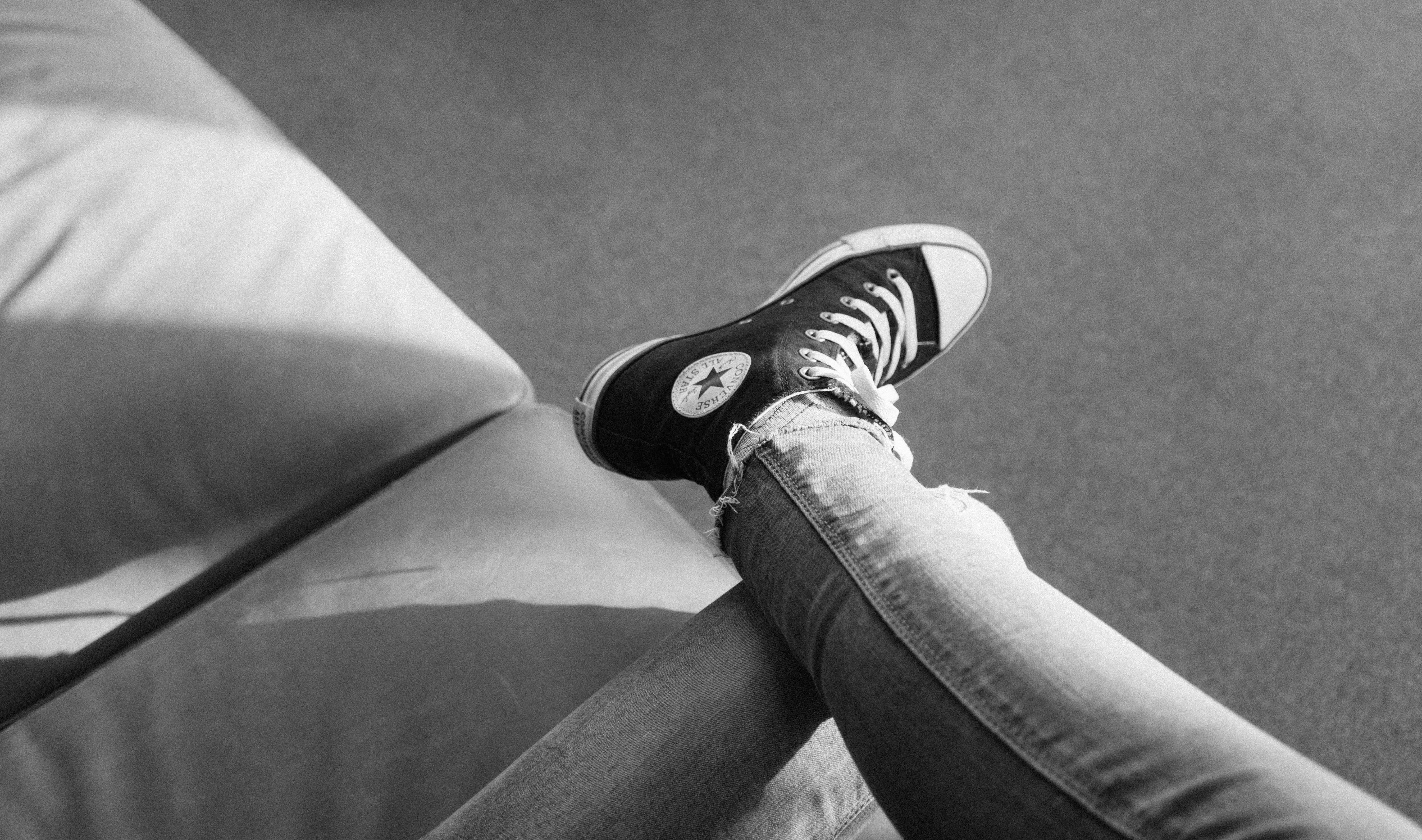 black and white photography of converse