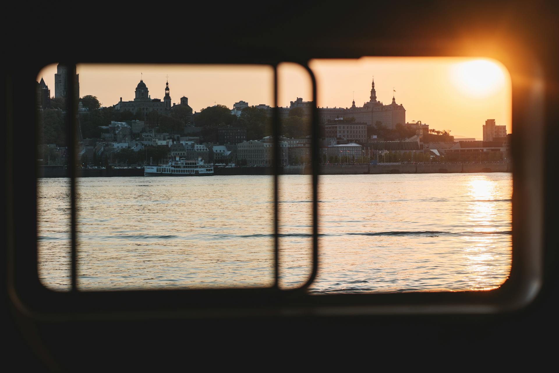 Coast in City at Sunset behind Vessel Windows