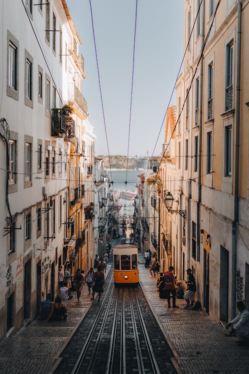 Vintage Tram on Narrow Street in Lisbon