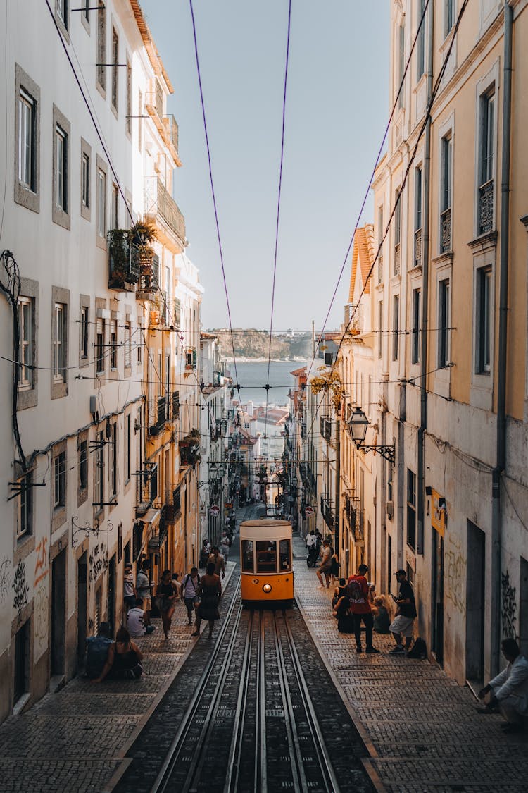 Vintage Tram On Narrow Street In Lisbon