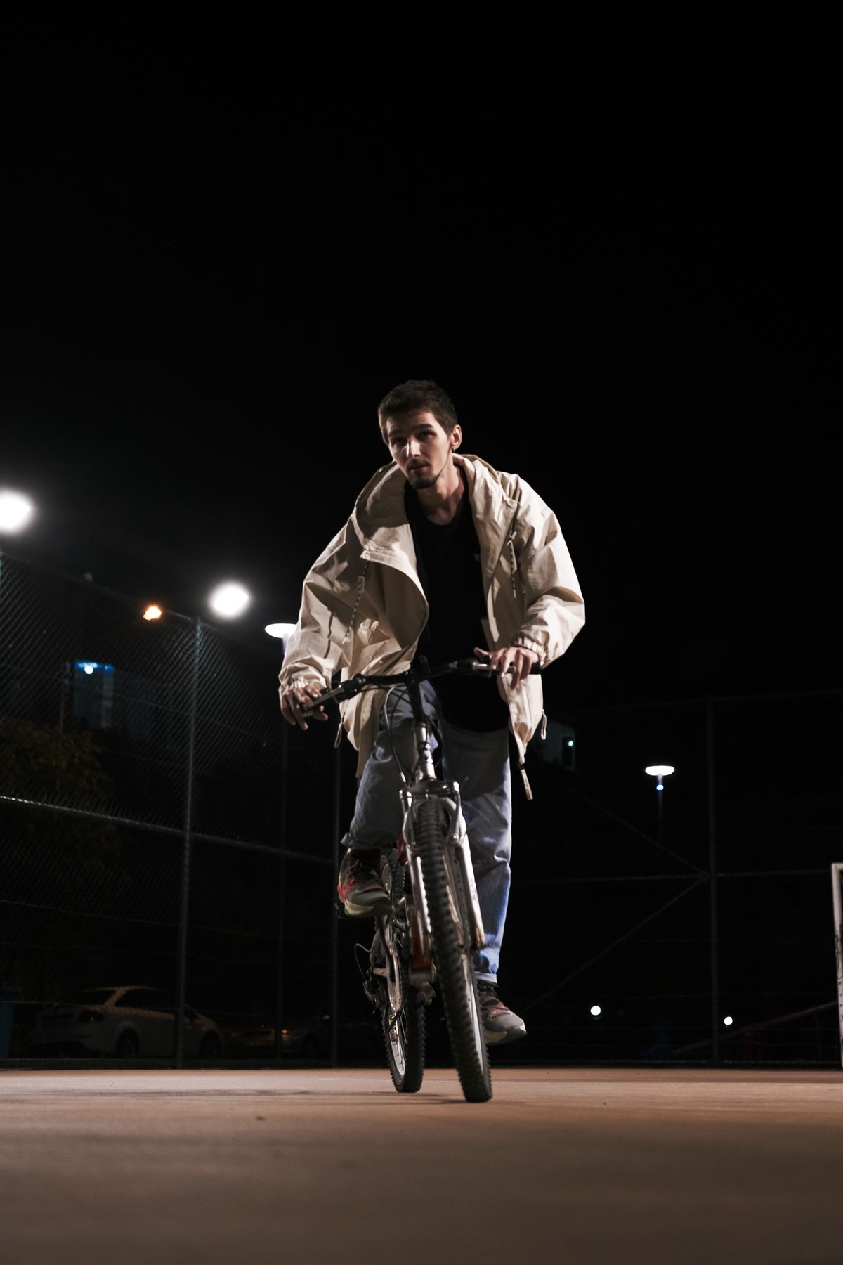 Cyclist riding through a city at night