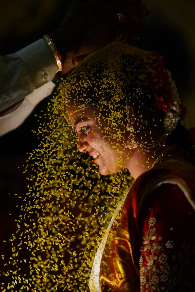 Rice Grain Poured Over Bride