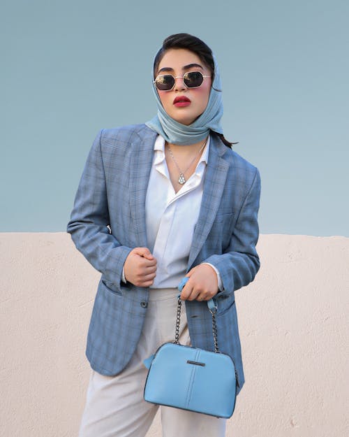Portrait of Woman in Blue Suit and with Bag